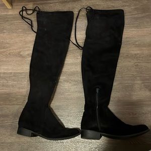 Black flat over the knee boots
